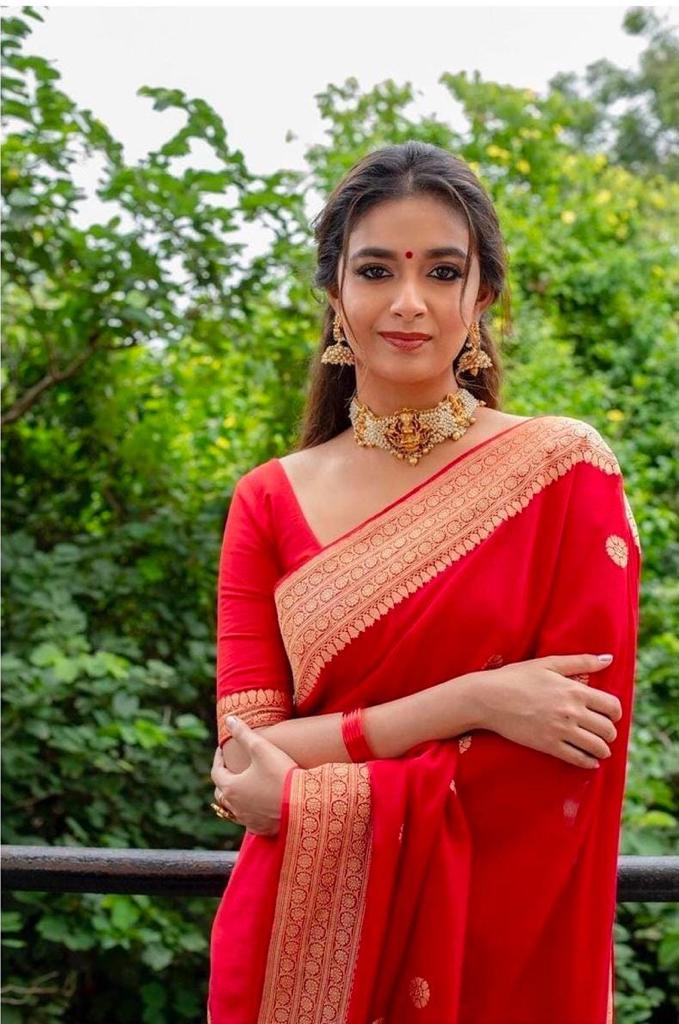 A glam Red Soft Silk Saree With Classic Blouse Piece