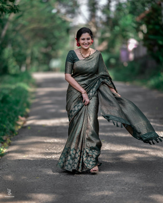 Surpassing Dark Green Soft Silk Saree With Dazzling Blouse Piece