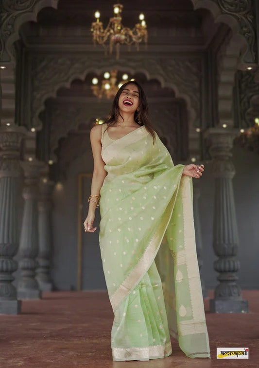Surpassing Dark Green Soft Silk Saree With Dazzling Blouse Piece